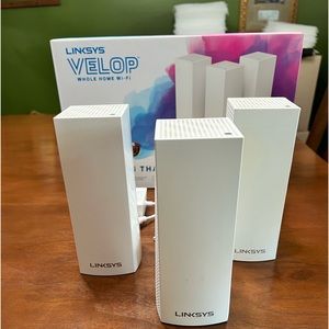 Linksys WiFi Mesh system with Linksys router and Netgear switch.